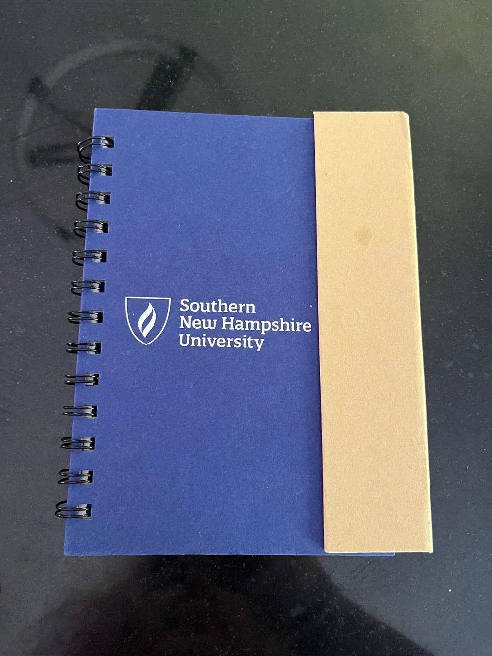 Blue Spiral Notebook with Tan Elastic SNHU